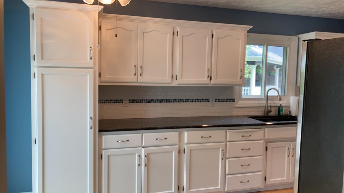 Kitchen cabinet painting and refinishing before and after photos - cabinet transformation Omaha